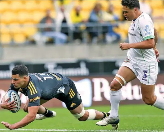  ?? Photo: Stuff ?? Swire Shipping Fijian Drua first five eight Caleb Muntz (right) chases Joshua Moorby who scores the first of his two first-half tries during their Super Rugby Pacific clash at thge Sky Stadium in Wellington on May 8, 2022.