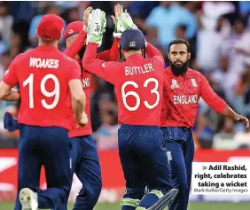  ?? Mark Kolbe/Getty Images ?? Adil Rashid, right, celebrates taking a wicket