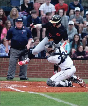  ??  ?? Gordon Lee catcher Dylan Minghini puts the tag on Sonoravill­e’s Matthew Vincent after hauling in a strike from Trojan centerfiel­d Chaney Rogers to record an out during their game last Tuesday. (Messenger photo/Scott Herpst)