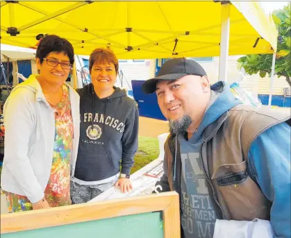  ??  ?? A WINNER?: Stephen Allen buys some tickets for the mega raffle at Saturday’s Paparore School Whanau/Gala Day from Bella Stevenson and Joanne Windelborn.