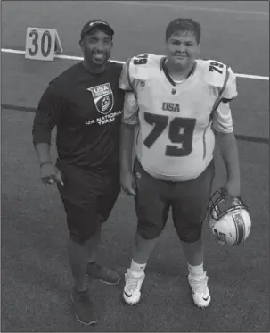  ?? Submitted photo ?? LINING UP: Fountain Lake freshman lineman Nicholas Soileau, right, is joined by his offensive line coach, Desmund Farris of Texas A&amp;M-Commerce, after the USA Football Middle School Bowl Game last month in Frisco, Texas.