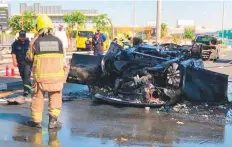  ??  ?? The mangled remains of Dr John Marshall’s car near the World Trade Centre roundabout in Dubai on November 26.