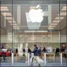  ?? PHOTO: AFP ?? A person walks past an Apple Inc store in Chicago, Illinois, on March 21.