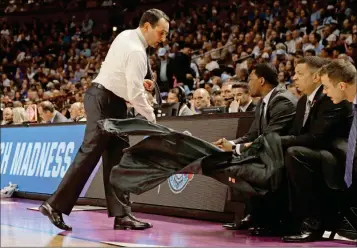  ?? ASSOCIATED PRESS PHOTOS ?? DUKE HEAD COACH MIKE KRZYZEWSKI THROWS HIS JACKET on the floor during the first half in a second-round game against South Carolina in the NCAA Tournament in Greenville, S.C., Sunday.