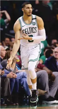  ?? MADDIE MEYER/ GETTY IMAGES ?? Celtics rookie forward Jayson Tatum ( 28 points, 8- for- 16 from the field) celebrates a three- pointer.