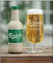  ?? CARLSBERG ?? Denmark’s Carlsberg brewery has released two beer bottle prototypes made of paper — or rather, sustainabl­y sourced wood fiber.