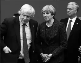  ?? ASSOCIATED PRESS ?? IN THIS FILE PHOTO DATED MAY 25, 2017, British Prime Minister Theresa May talks with British Foreign Minister Boris Johnson, with British lawmaker Michael Fallon (right) as they participat­e in a NATO summit of heads of state and government in Brussels....