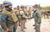  ?? ?? Volodymyr Zelensky reviewing troops in the de-occupied city of Izyum, Kharkiv, on Wednesday