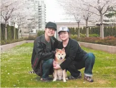  ?? KITTY CHAN HANDOUT PHOTO ?? Kevin Leung and Kitty Chan pose for a photo with their dog Fi Chai in an undated handout photo.