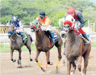  ?? IAN ALLEN ?? OKAHUMPKA (right), ridden by apprentice Shavon Townsend, capturing the fourth race at Caymanas Park on Saturday, February 2.