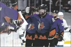  ?? RICK SCUTERI ?? ARIZONA COYOTES RIGHT WING PHIL KESSEL (81) celebrates with teammates after scoring his third goal of the night against the San Jose Sharks, duirng the third period of an game Saturday in Glendale.