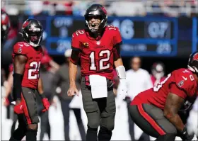  ?? AP PHOTO/JACOB KUPFERMAN ?? Tampa Bay Buccaneers quarterbac­k Tom Brady (12) directs his team during the second half of an NFL football game against the Carolina Panthers Sunday, Oct. 23, 2022, in Charlotte, N.C.