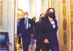  ?? AP PHOTO/J. SCOTT APPLEWHITE ?? Vice President Kamala Harris arrives at the Capitol as the Senate convenes for a rare weekend session on the $1 trillion bipartisan infrastruc­ture bill Saturday.