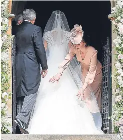  ??  ?? Top, Pippa and James leave St Mark’s after tying the knot. Above, big sister Kate makes sure the dress is just right. Right, the duchess with her daughter Princess Charlotte.