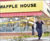  ?? AP PHOTO ?? Law enforcemen­t officials work the scene of a fatal shooting at a Waffle House in the Antioch neighbourh­ood of Nashville, Sunday.