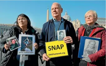  ?? AP ?? Survivors Network of those Abused by Priests (SNAP) president Tim Lennon, from Arizona, and SNAP members Esther Hatfield Miller, from California, left, and Carol Midboe, from Texas, protest in St Peter’s Square at the Vatican yesterday.
