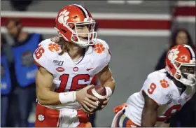  ?? KARL B DEBLAKER - THE ASSOCIATED PRESS ?? Clemson’s Trevor Lawrence (16) looks to throw the ball during the first half of a game against North Carolina State in Raleigh, N.C., Saturday, Nov. 9, 2019.