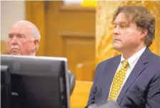  ?? RODNEY WHITE/THE DES MOINES REGISTER ?? Texas businessma­n Robert Rhodes, right, faces a judge with his attorney Joseph Cahill in Polk County District Court in Des Moines, Iowa, in January.