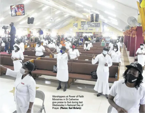  ?? (Photos: Karl Mclarty) ?? Worshipper­s at Power of Faith Ministries in St Catherine give praise to God during last Wednesday’s National Day of Prayer.