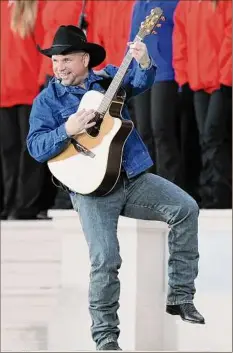  ?? Jewel Samad / Getty Images ?? Garth Brooks has postponed the sale of tickets to his July 23 Buffalo concert following Saturday’s mass shooting there.