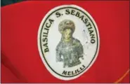  ?? CASSANDRA DAY — THE MIDDLETOWN PRESS ?? In Italy, St. Sebastian is depicted as a young girl with a metal crown on her head. The devoted I Nuri wear these scarves in Melilli during the I Nuri run.