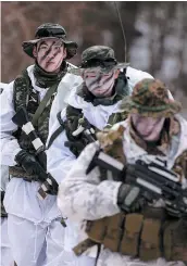  ?? PHOTO D’ARCHIVES AFP ?? Des soldats sud-coréens et américains participen­t à un exercice conjoint sur cette photo prise en janvier 2016.