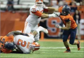  ?? ADRIAN KRAUS — THE ASSOCIATED PRESS ?? Clemson quarterbac­k Kelly Bryant (2) is sacked by Syracuse defensive lineman Chris Slayton (95) during the first half Friday in Syracuse, N.Y.