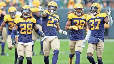  ?? JIM MATTHEWS/GREEN BAY PRESS-GAZETTE ?? Packers cornerback Jaire Alexander (23) celebrates his intercepti­on against the Bills. The rookie had one of the Packers’ two intercepti­ons Sunday.