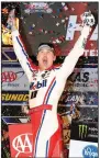  ?? AP/LARRY PAPKE ?? Kevin Harvick celebrates in Victory Lane after winning Sunday’s NASCAR Cup race at Texas Motor Speedway in Fort Worth.