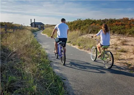  ??  ?? PEACEFUL JOURNEY: Biking through the natural beauty surroundin­g the Cape Cod gem of Provinceto­wn is a joy that extends past traditiona­l summer months.