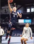  ?? Michael Conroy / Associated Press ?? UConn’s Paige Bueckers (5) gets a basket on a fast break against Butler on Saturday.
