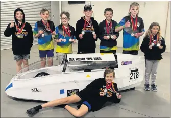  ?? ?? ALL SMILES: National title winners, from left, Ollie Mills, Noah Bouma, Olly Webster, Lachlan North, William Koch, Jack Mills, Charlie Pietsch and Aiden Reinheimer, front. Lucy Pietsch also competed.