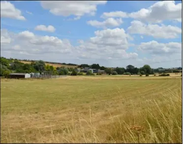  ?? ?? A view of where the hamlet once stood — today just a field and electricit­y substation