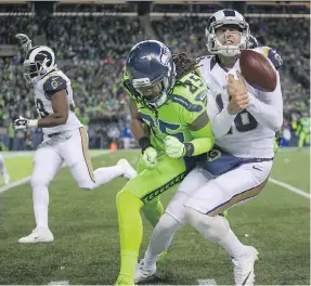  ?? DEAN RUTZ/ASSOCIATED PRESS ?? Richard Sherman and the Seattle Seahawks knocked around L.A. Rams quarterbac­k Jared Goff last season, but the Rams are looking good in the early going this year.