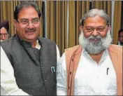  ??  ?? INLD leader Abhay Chautala and health minister Anil Vij at the Haryana Assembly in Chandigarh on Thursday. KESHAV SINGH/HT