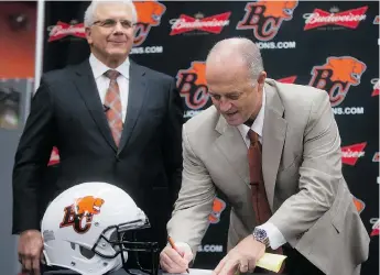  ?? DARRYL DYCK/THE CANADIAN PRESS FILES ?? B.C. Lions head coach Jeff Tedford, right, is set to reveal his new staff later this month.