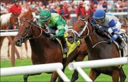  ?? PHOTO CHELSEA DURAND/NYRA ?? Raging Bull with Joel Rosario aboard heading to the win of Friday’s Grade 2 National Museum of Racing and Hall of Fame stakes race at Saratoga Race Course.