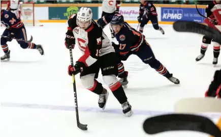  ?? CITIZEN FILE PHOTO ?? Matej Toman of the Prince George Cougars breaks out of his zone, with Kamloops Blazers forward Brodi Stuart hot on his heels during a September preseason game at CN Centre. The Cougars will host the Blazers tonight and Sunday afternoon.