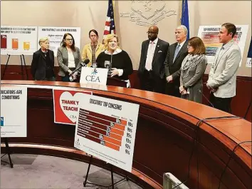  ?? Alex Putterman / Hearst Connecticu­t Media ?? Flanked by state legislator­s Tuesday in Hartford, CEA president Kate Dias, center, called on lawmakers to address poor working conditions for teachers, which have helped contribute to a statewide educator shortage.