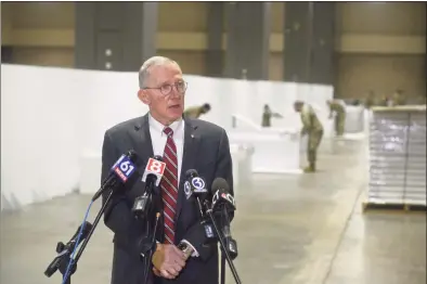  ??  ?? Dr. James P. Cardon, Hartford HealthCare chief clinical integratio­n officer, speaks to the media on Friday. The Connecticu­t National Guard set up a field hospital in the Connecticu­t Convention Center on Friday.