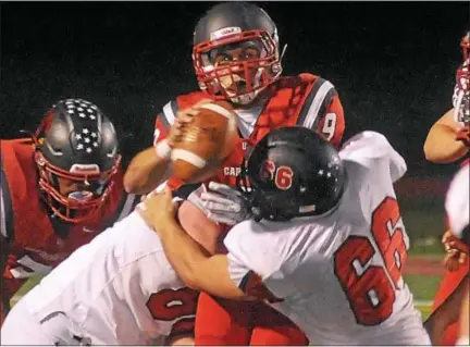  ?? GENE WALSH — DIGITAL FIRST MEDIA ?? Upper Dublin quarterbac­k Julian Gimbel runs into a swarm of Hatboro-Horsham defenders Friday night.