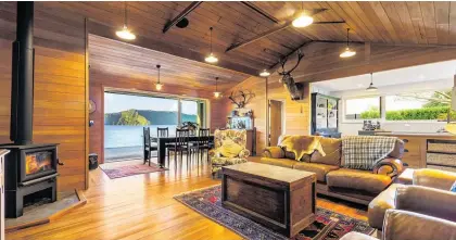  ?? ?? This 100-year-old Lake Rotoiti house won the builders who completed its renovation an award at this year’s House of the Year awards.