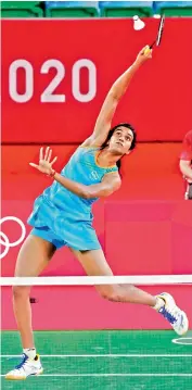  ?? —
PTI ?? P. V. Sindhu plays a shot on way to beating Hong Kong’s Ngan Yi Cheung in their women’s singles match in Tokyo on Wednesday. Sindhu won 21-9, 21-16.