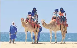  ??  ?? CAMEL RIDES ON THE BEACH NEAR CABO SAN LUCAS