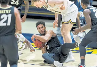  ?? John Hefti, The Associated Press ?? Colorado guard D'Shawn Schwartz gets possession against California during the second half Saturday in Berkeley, Calif.