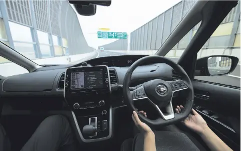  ?? Photos by Takashi Aoyama / Special to The Chronicle ?? Chronicle staff writer Wendy Lee takes a test drive in a Nissan Serena minivan equipped with the ProPilot system in Yokohama, Japan.