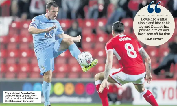  ??  ?? City’s Michael Doyle battles with Swindon’s James Dunne before the altercatio­n that saw the Robins man dismissed