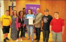  ?? PHOTOS PROVIDED ?? Troy Mayor Patrick Madden presents a proclamati­on to students in the Troy City School District’s 21st Century Afterschoo­l Program and the program’s director, Amanda Hooker, during a Thursday afternoon event at Troy Middle School.