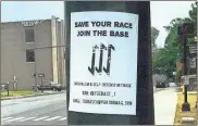  ??  ?? A poster advocating for the Base, a white supremacis­t group, was found outside the Floyd County Courthouse.