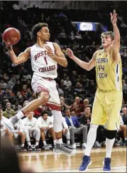  ?? FRANK FRANKLIN II / ASSOCIATED PRESS ?? Boston College’s Jerome Robinson passes as Georgia Tech’s Ben Lammers defends during the second half of their first-round game in the Atlantic Coast Conference tournament on Tuesday in New York. Boston College won 87-77, their first win in the ACC...